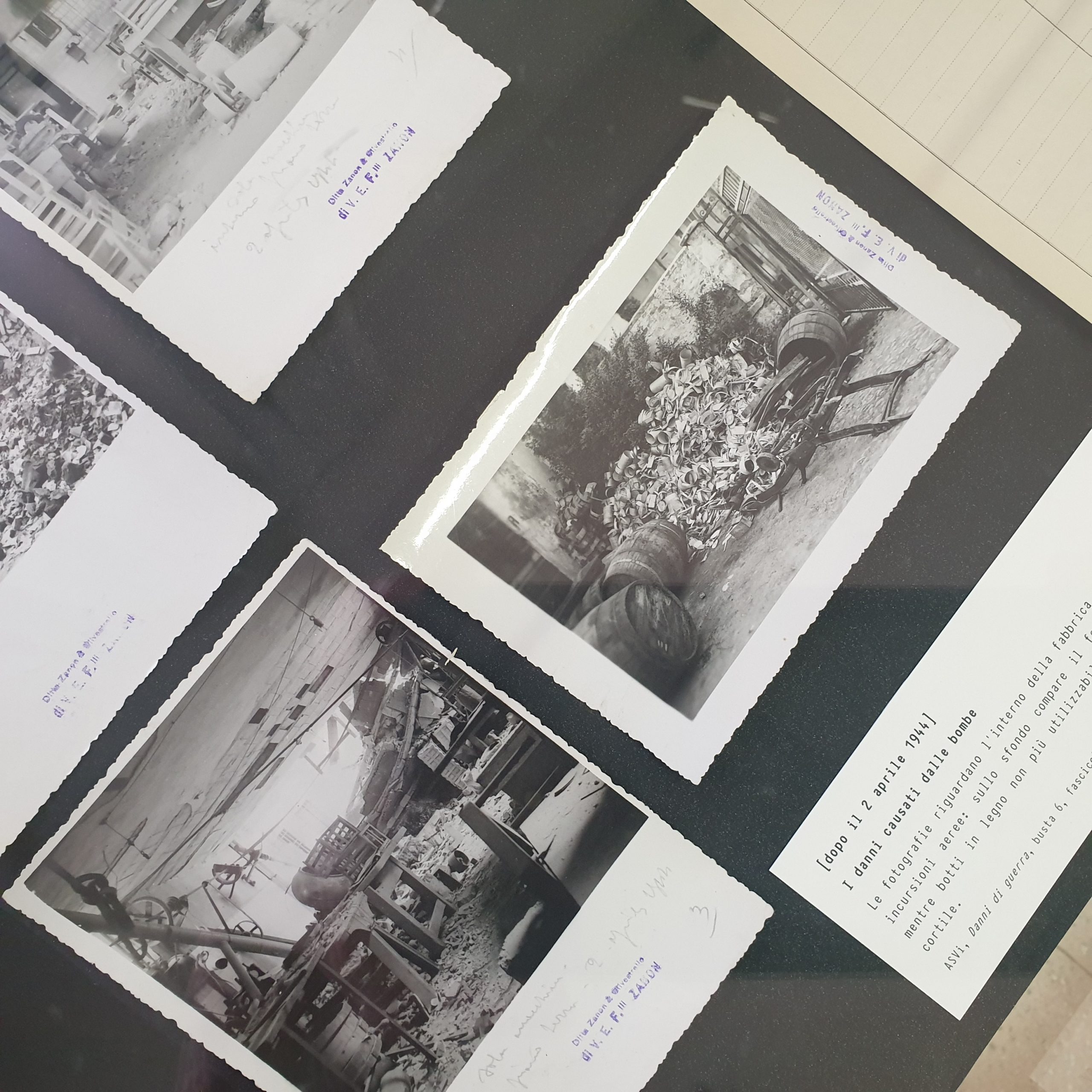 Cartellone con stampe di foto dei danni dai bombardamenti alla ditta Zanon di Vicenza